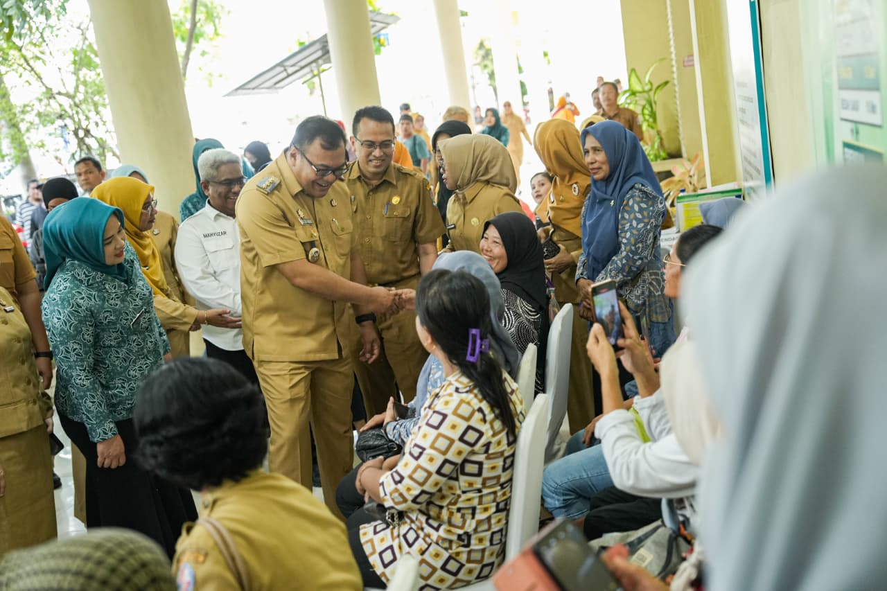 Bupati Asri Ludin Tambunan melaporkan capaian 70 akseptor MOW pada Kick Off Pelayanan KB Serentak di Deli Serdang